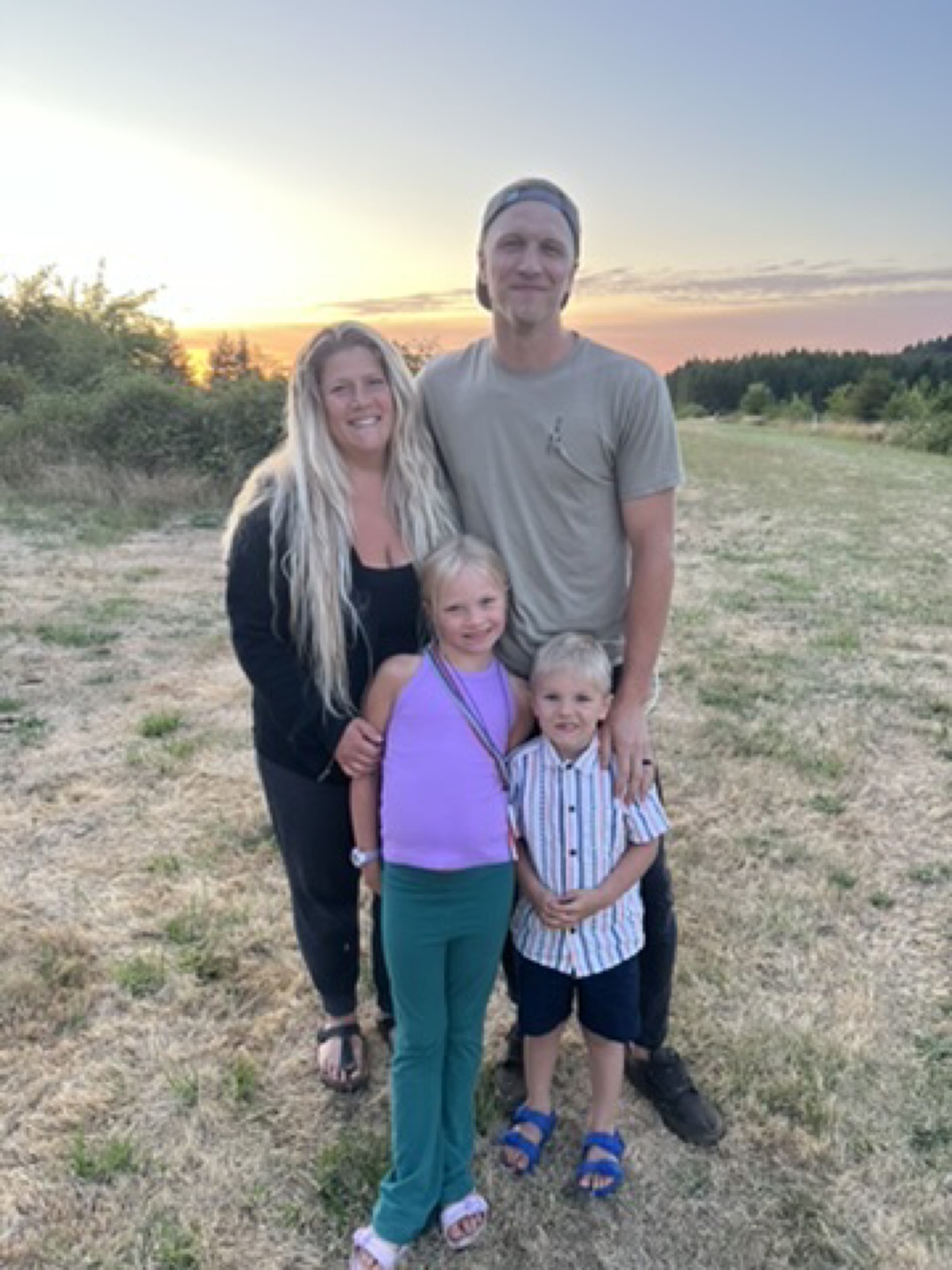 Tylor Stone with his family at sunset