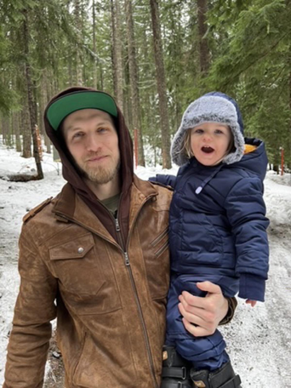 Tylor and his son on a winter hike